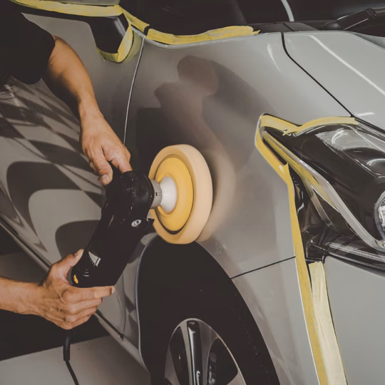 Polishing a masked vehicle body